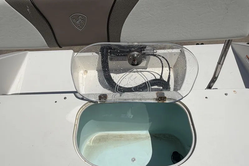 Slide: The Image of Open livewell on a 2016 Century 2301 Center Console boat, showcasing interior details. - 69
