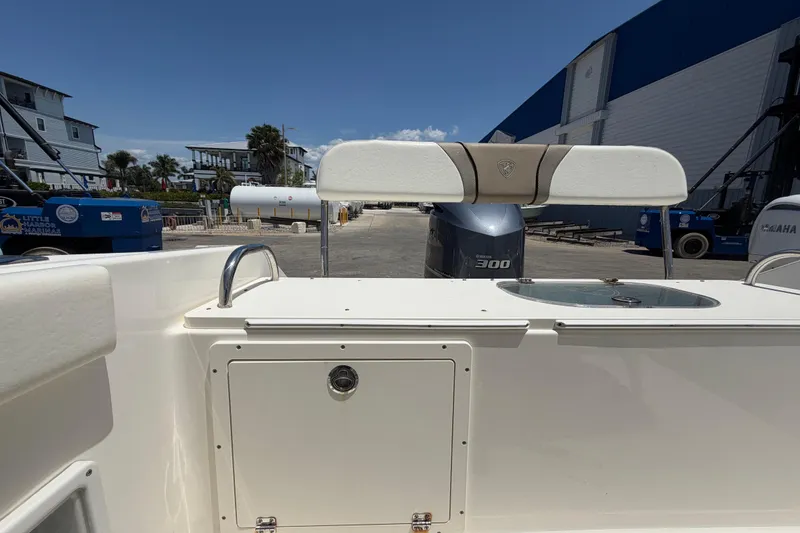 Slide: The Image of 2016 Century 2301 Center Console boat with Yamaha 300 engine at a marina. - 71