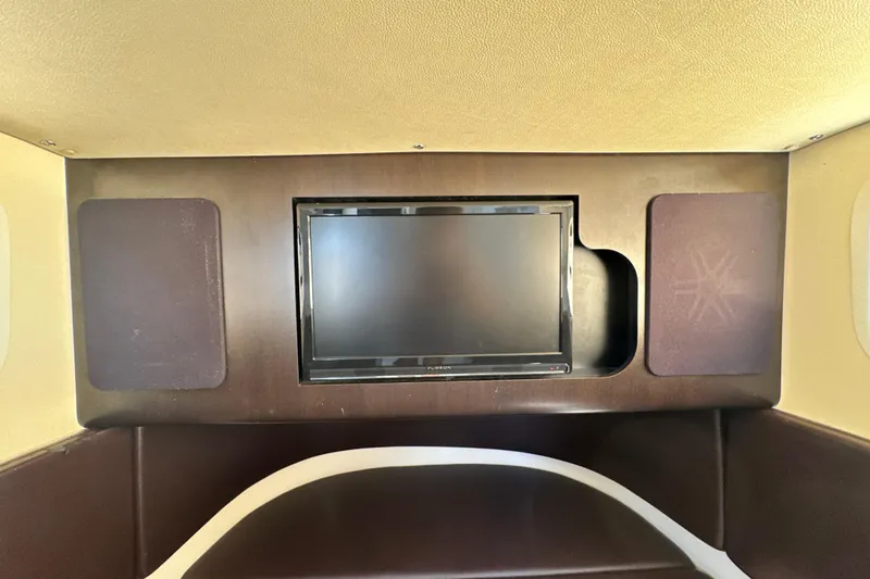 Slide: The Image of 2018 Scout 355 LXF cabin interior with built-in TV and speaker system. - 44