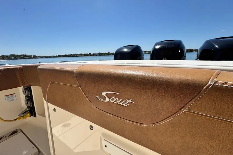 Slide: The Image of 2018 Scout 355 LXF boat interior with leather detailing and outboard motors. - 57