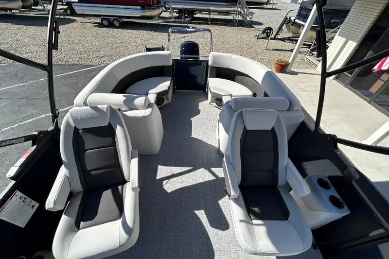 Slide: The Image of 2026 Harris Cruiser 230 CWDH pontoon boat interior with plush seating and modern design. - 10