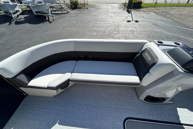 Slide: The Image of 2026 Harris Cruiser 230 CWDH boat interior with sleek seating and modern design. - 14