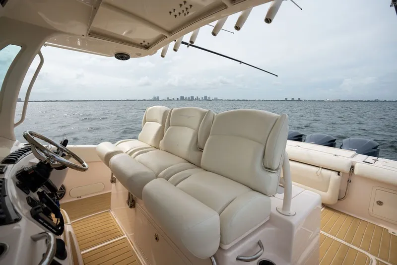 Slide: The Image of 2014 Grady-White Canyon 376 boat interior with plush seating and ocean view. - 47