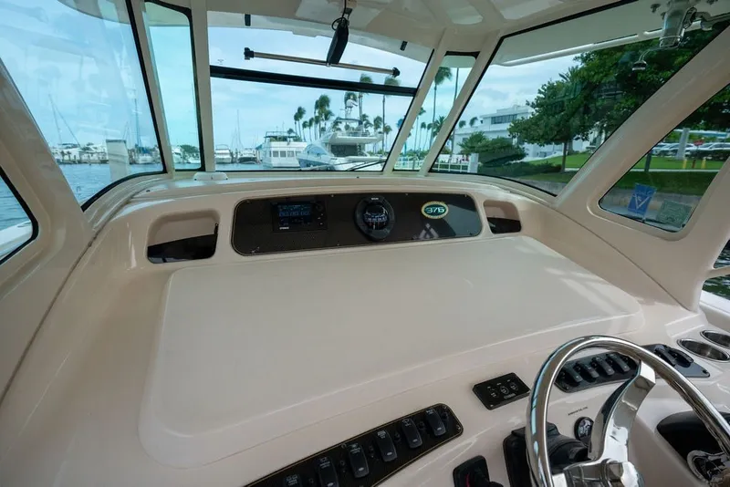 Slide: The Image of Interior view of 2014 Grady-White Canyon 376 boat cockpit with steering wheel and controls. - 42