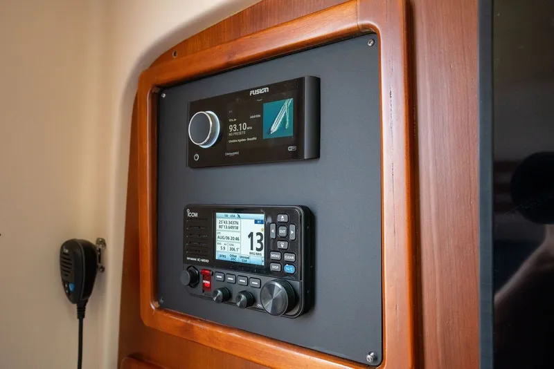 Slide: The Image of Control panel on 2014 Grady-White Canyon 376 boat with radio and navigation systems. - 58