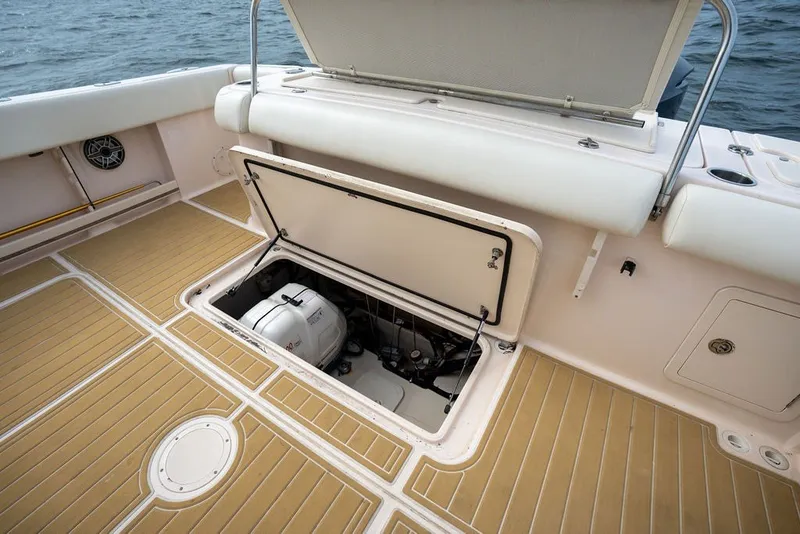 Slide: The Image of 2014 Grady-White Canyon 376 boat with open hatch revealing storage compartment. - 53