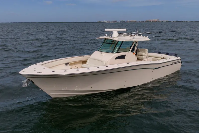 Slide: The Image of 2014 Grady-White Canyon 376 boat cruising on open water. - 7