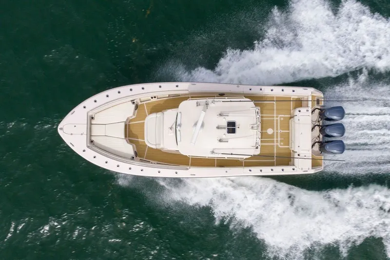 Slide: The Image of Overhead view of 2014 Grady-White Canyon 376 boat cruising on water. - 15