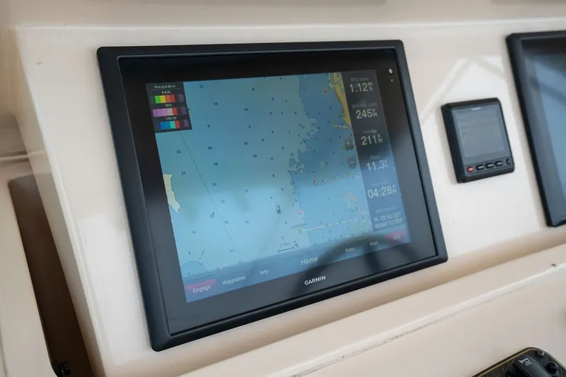 Slide: The Image of Garmin navigation display on 2014 Grady-White Canyon 376 boat dashboard. - 39
