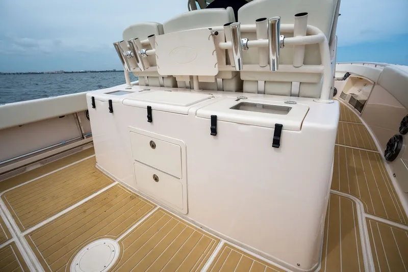 Slide: The Image of 2014 Grady-White Canyon 376 boat deck with rod holders and storage compartments. - 30