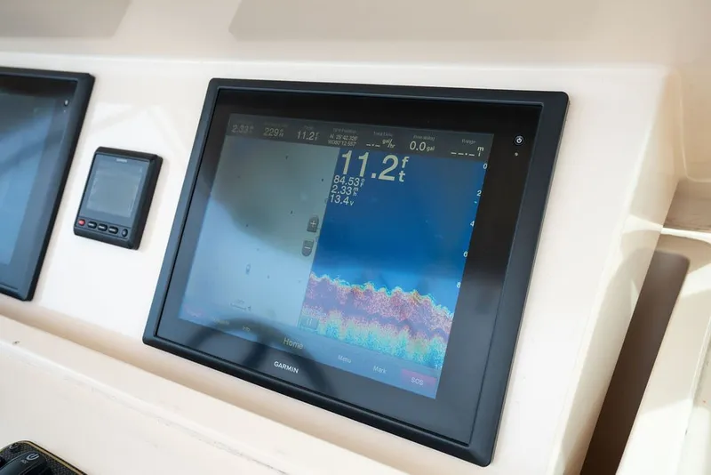 Slide: The Image of Garmin marine display on 2014 Grady-White Canyon 376 boat dashboard. - 40