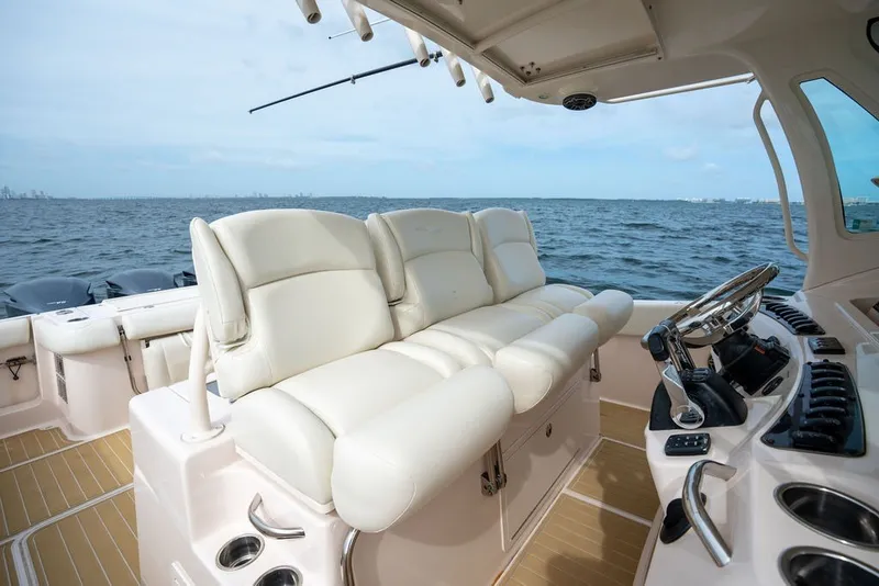 Slide: The Image of 2014 Grady-White Canyon 376 boat interior with plush seating and ocean view. - 46