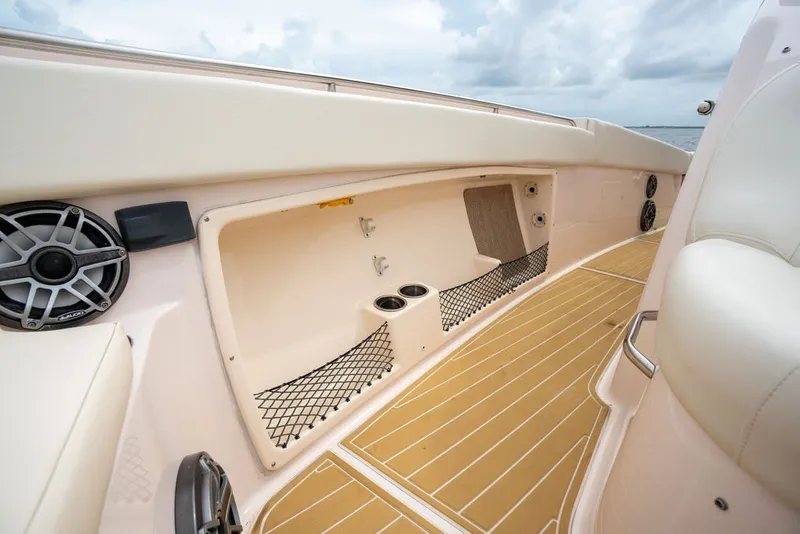 Slide: The Image of 2014 Grady-White Canyon 376 boat interior with storage and speakers. - 22