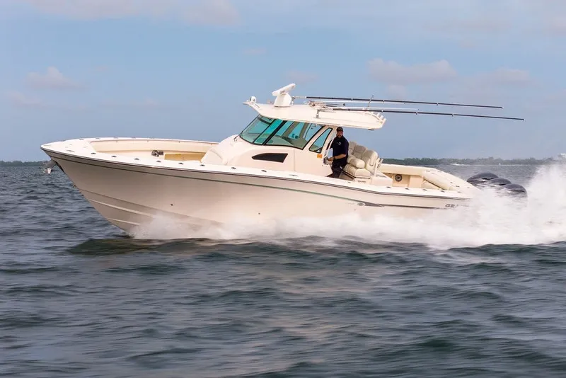 Slide: The Image of 2014 Grady-White Canyon 376 boat cruising on open water. - 14