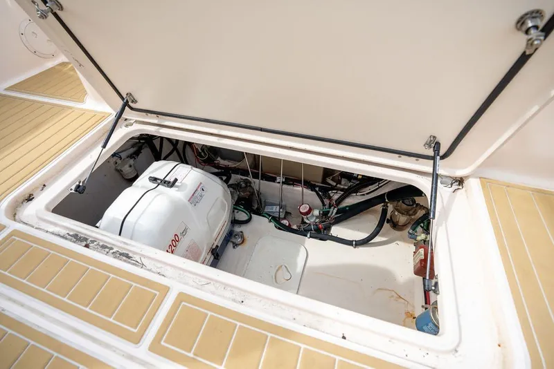 Slide: The Image of Open hatch of 2014 Grady-White Canyon 376 boat showing engine compartment. - 49