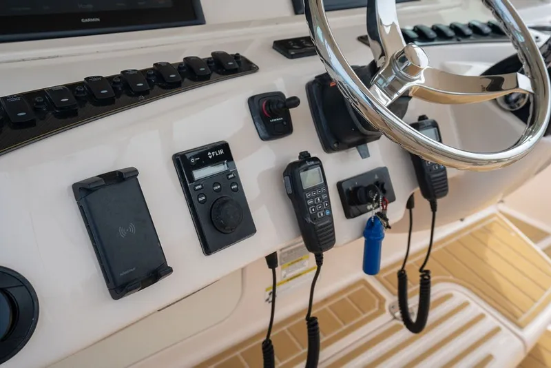 Slide: The Image of Control panel of 2014 Grady-White Canyon 376 boat with steering wheel and electronics. - 38