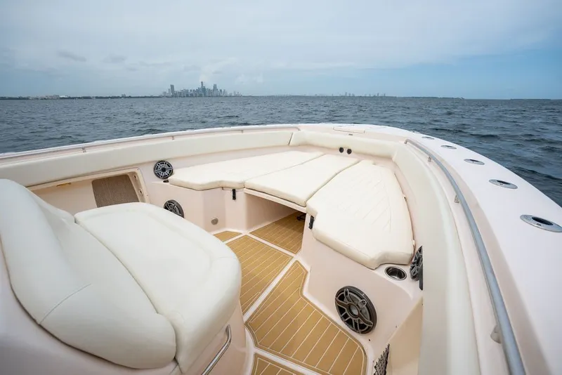 Slide: The Image of 2014 Grady-White Canyon 376 boat interior with city skyline in background. - 16