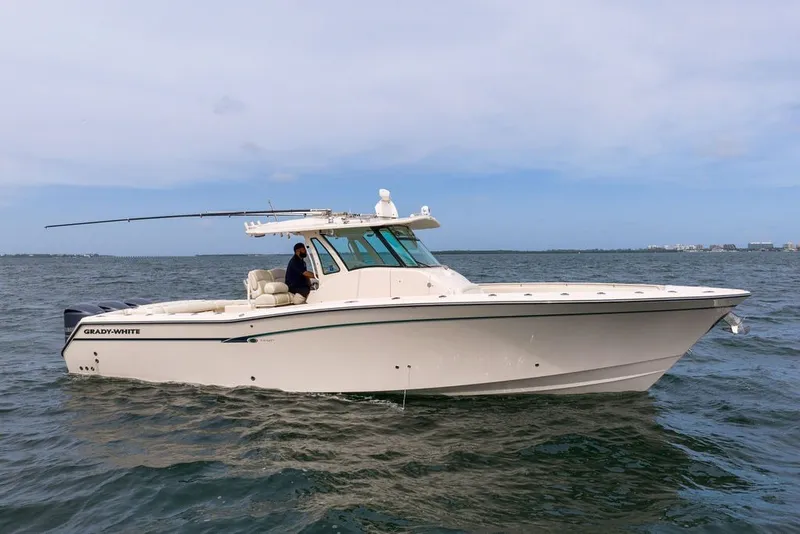 Slide: The Image of 2014 Grady-White Canyon 376 boat cruising on open water. - 1