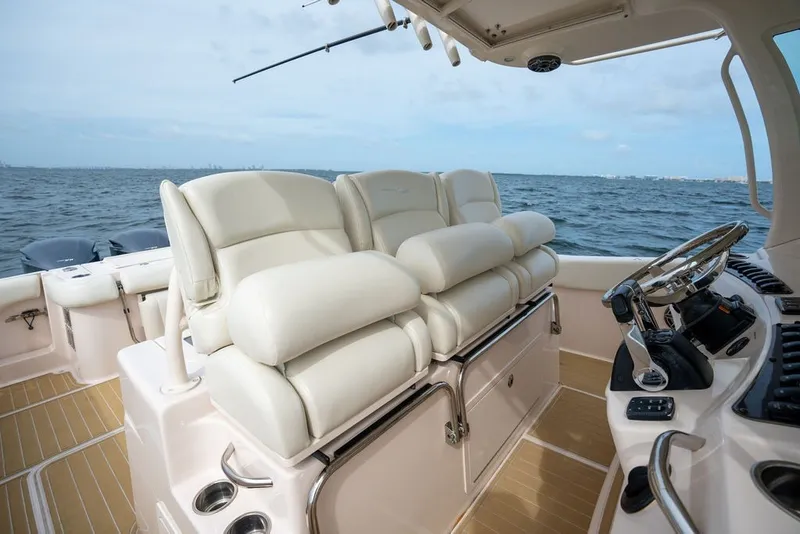 Slide: The Image of Luxurious interior of 2014 Grady-White Canyon 376 boat with plush seating and steering console. - 45