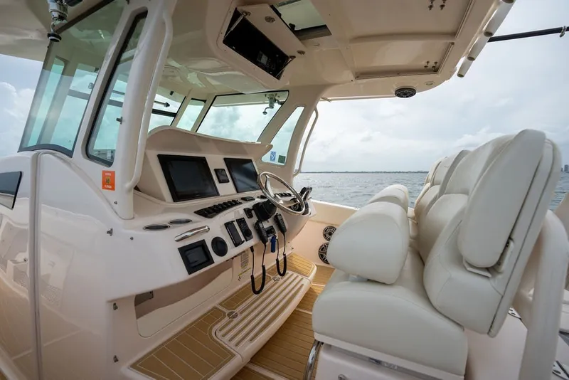 Slide: The Image of Interior view of 2014 Grady-White Canyon 376 boat with modern helm and seating. - 37