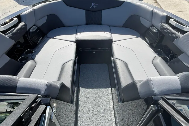 Slide: The Image of Interior of 2026 MasterCraft XT24 boat with spacious seating and modern design. - 10