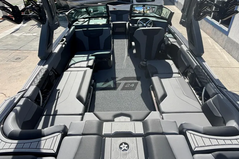 Slide: The Image of 2026 MasterCraft XT24 boat interior with sleek seating and modern design. - 4