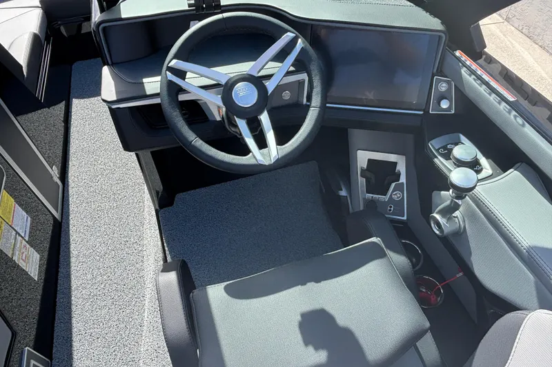 Slide: The Image of 2026 MasterCraft XT24 boat cockpit with modern steering wheel and control panel. - 5