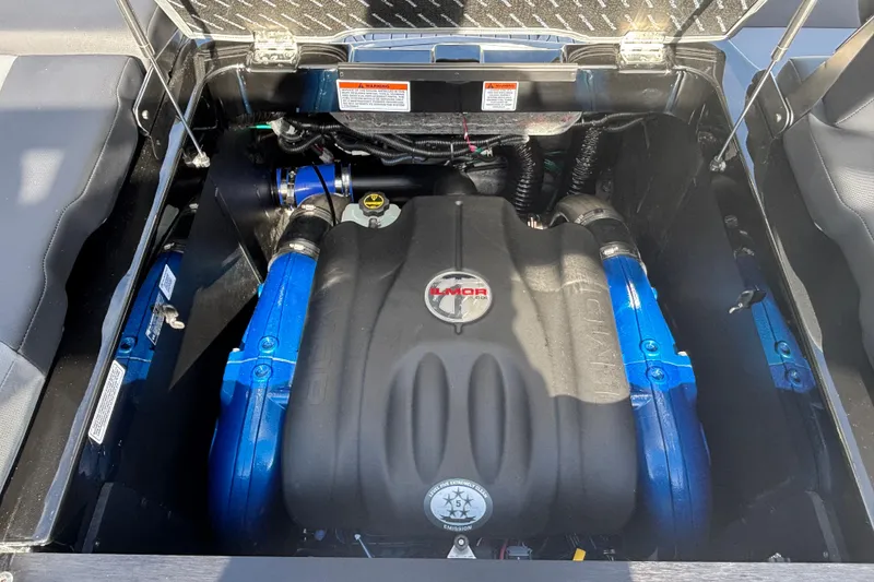 Slide: The Image of Engine compartment of 2026 MasterCraft XT24 boat, featuring a powerful motor. - 7