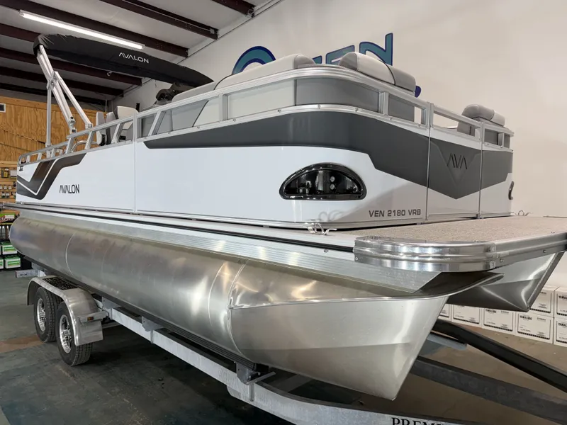 Slide: The Image of Avalon VNT VRB21 2026 pontoon boat in showroom. - 17