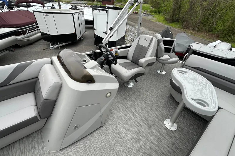 Slide: The Image of 2020 Bennington 20 SSNPX pontoon boat interior with seating and control console. - 10