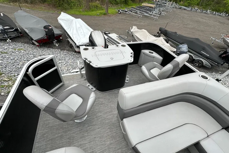 Slide: The Image of 2020 Bennington 20 SSNPX pontoon boat interior with seating and fishing setup. - 14