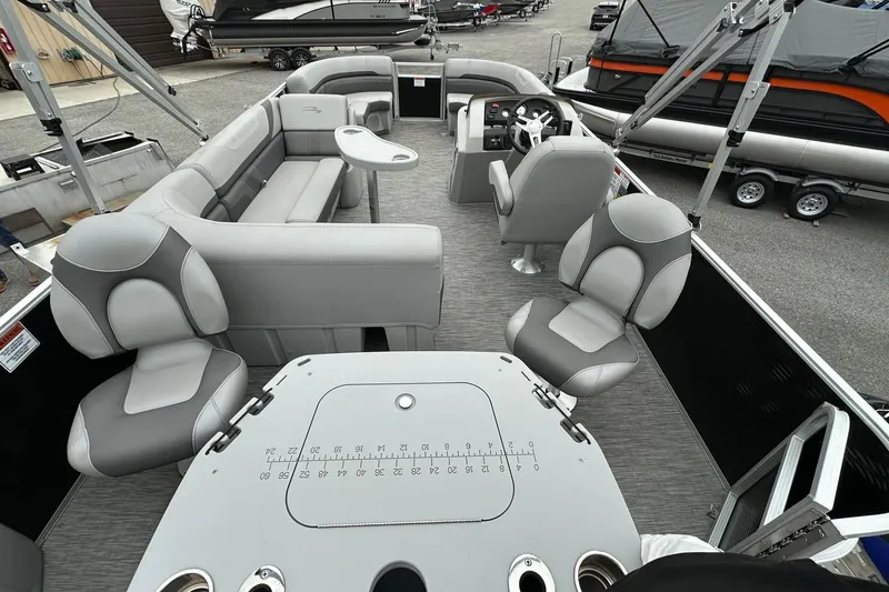 Slide: The Image of 2020 Bennington 20 SSNPX pontoon boat interior with seating and helm. - 15