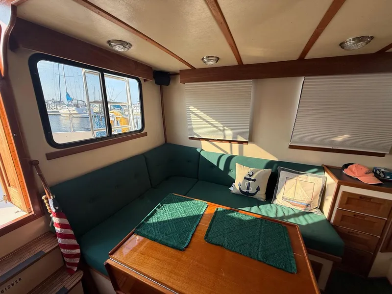 Slide: The Image of Cozy interior of a 1998 Nordic Tug Trawler with nautical-themed decor. - 3