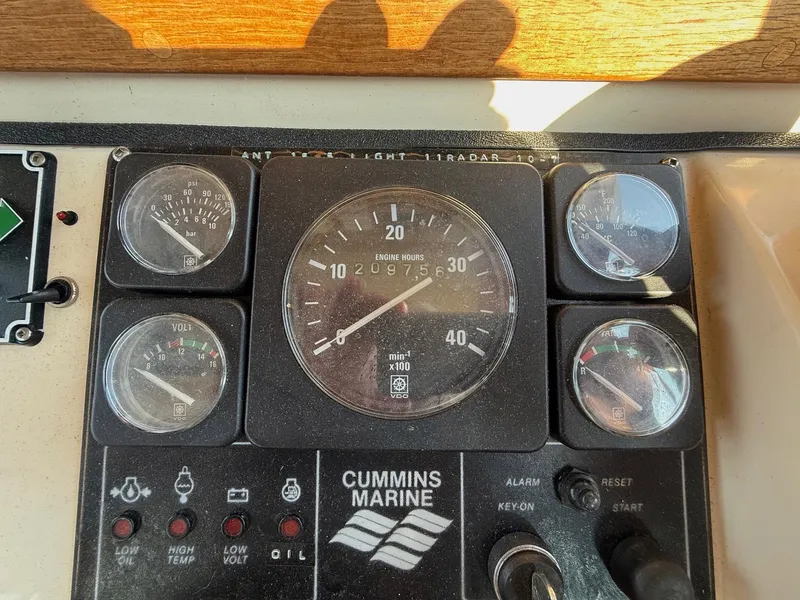 Slide: The Image of 1998 Nordic Tug Trawler dashboard with Cummins Marine engine gauges and controls. - 8