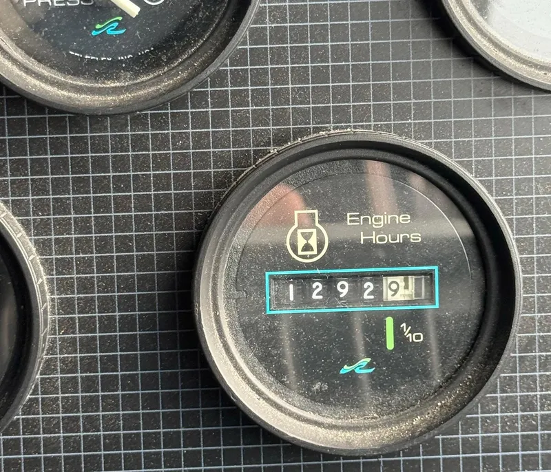 Slide: The Image of 1989 Sea Ray 460 Express Cruiser engine hour meter showing 1292.9 hours. - 13
