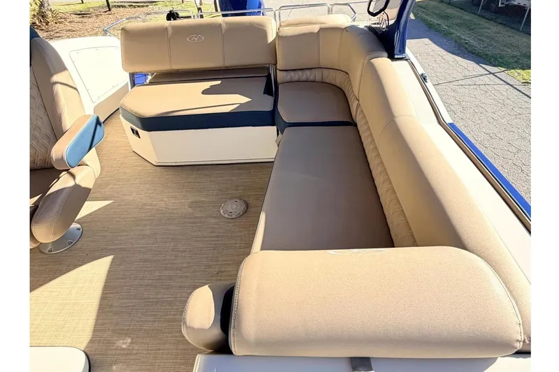 Slide: The Image of Luxurious seating on 2021 Harris Crowne SL 250 pontoon boat, featuring beige upholstery. - 10