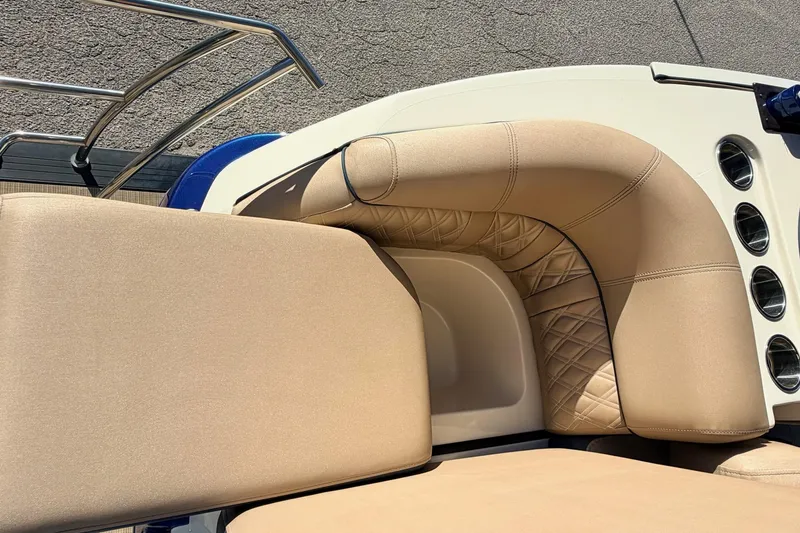 Slide: The Image of Luxurious seating on 2021 Harris Crowne SL 250 pontoon boat, featuring elegant beige upholstery. - 18