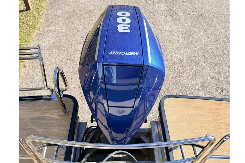 Slide: The Image of 2021 Harris Crowne SL 250 boat with blue Mercury outboard motor. - 19