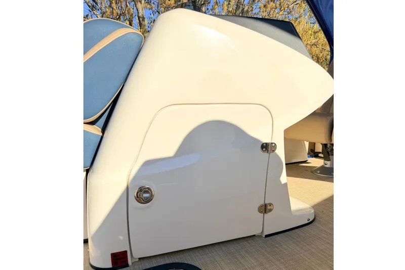 Slide: The Image of 2021 Harris Crowne SL 250 boat interior with sleek white panel and blue seating. - 20