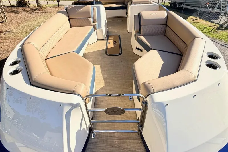 Slide: The Image of 2021 Harris Crowne SL 250 pontoon boat with spacious seating and elegant design. - 3