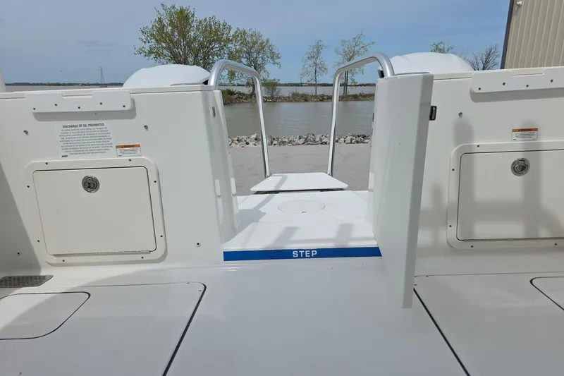 Slide: The Image of 2021 World Cat 296 DC boat stern view with step and storage compartments. - 13