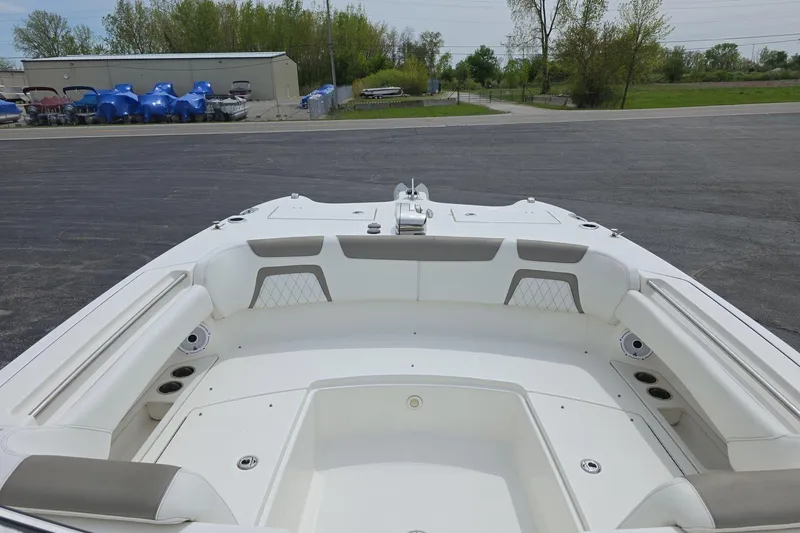 Slide: The Image of 2021 World Cat 296 DC boat interior with spacious seating and cup holders. - 17