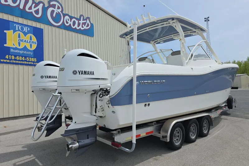 Slide: The Image of 2021 World Cat 296 DC boat with dual Yamaha engines on a trailer. - 3