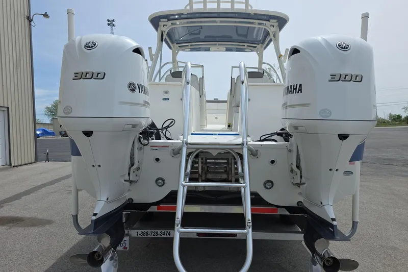 Slide: The Image of 2021 World Cat 296 DC boat with twin Yamaha 300 engines, rear view. - 4