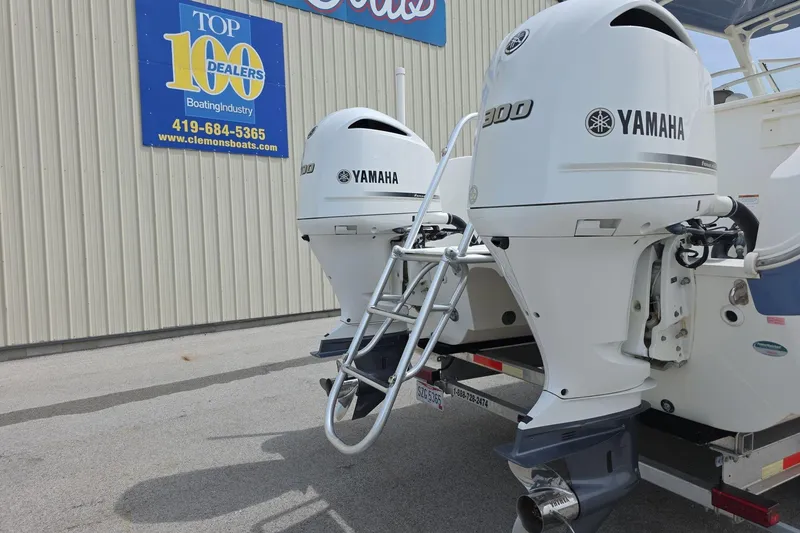 Slide: The Image of 2021 World Cat 296 DC with twin Yamaha 300 engines at dealership. - 5