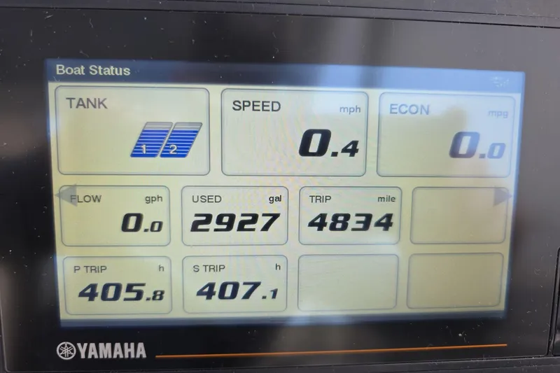 Slide: The Image of Yamaha boat status display showing fuel usage and trip data for 2021 World Cat 296 DC. - 6