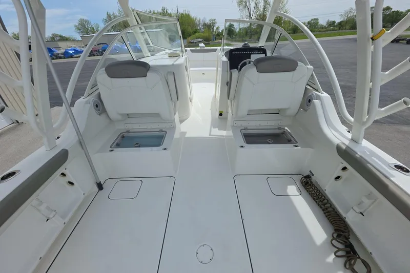 Slide: The Image of 2021 World Cat 296 DC boat interior with seating and storage compartments. - 7