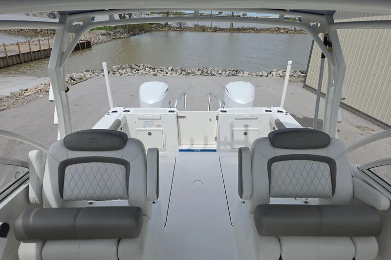 Slide: The Image of 2021 World Cat 296 DC boat interior with dual seating and water view. - 8