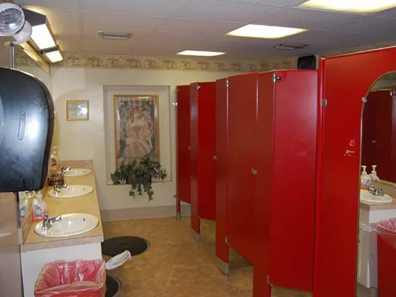 Slide: The Image of Red bathroom stalls and sinks on a 1985 Custom Serodino Dinner Boat. - 20