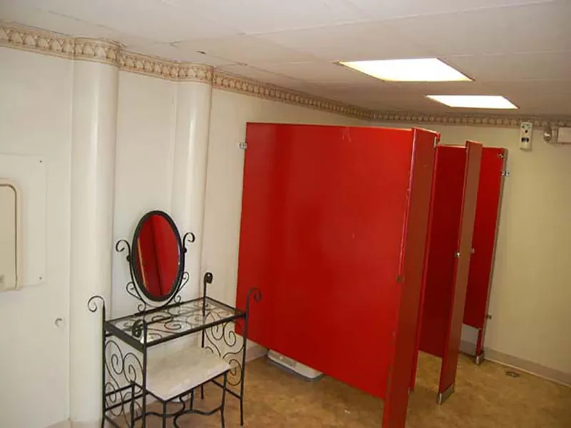 Slide: The Image of Restroom with red stalls and ornate vanity on a 1985 Custom Serodino Dinner Boat. - 21